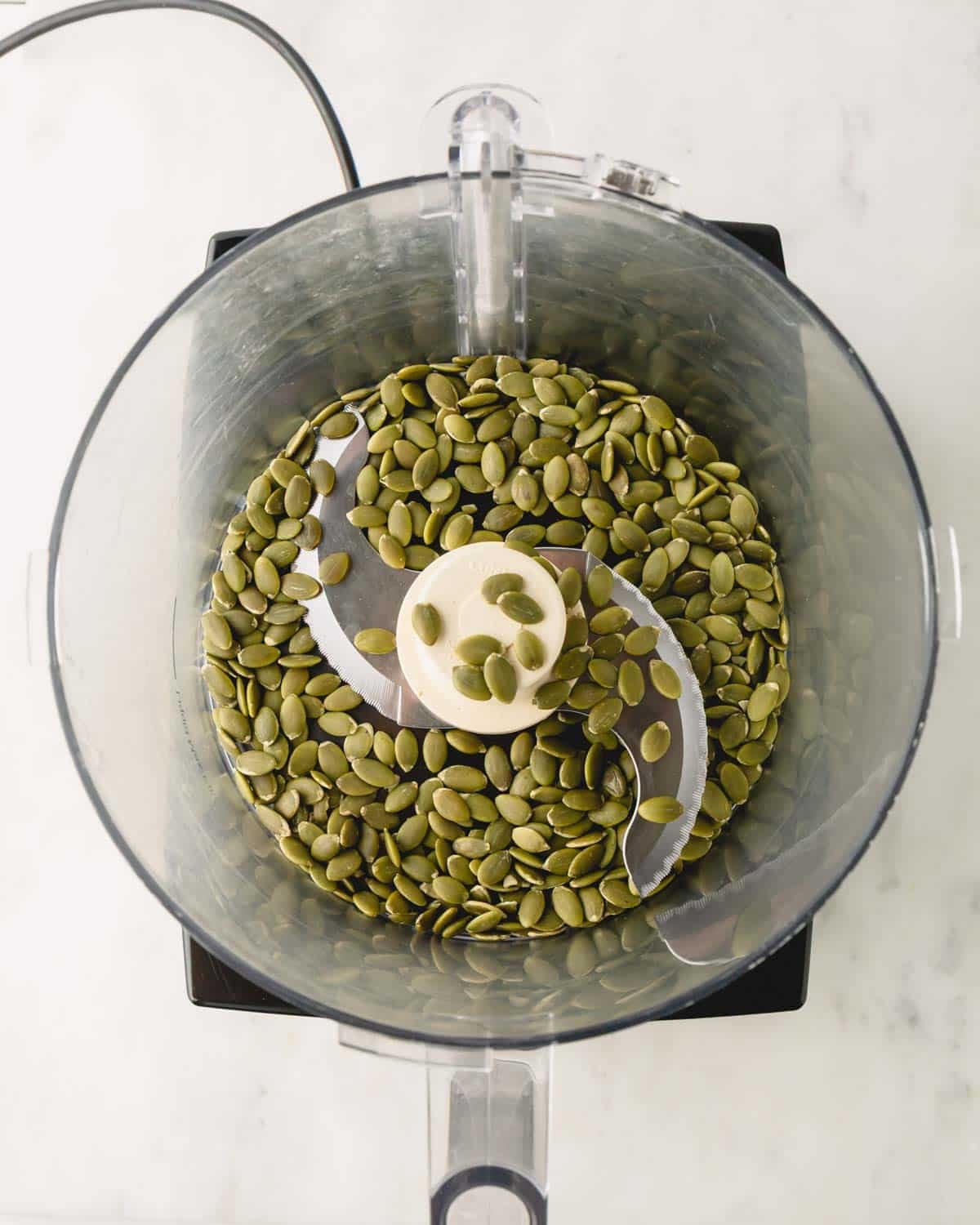 Pumpkin seeds in a food processor.