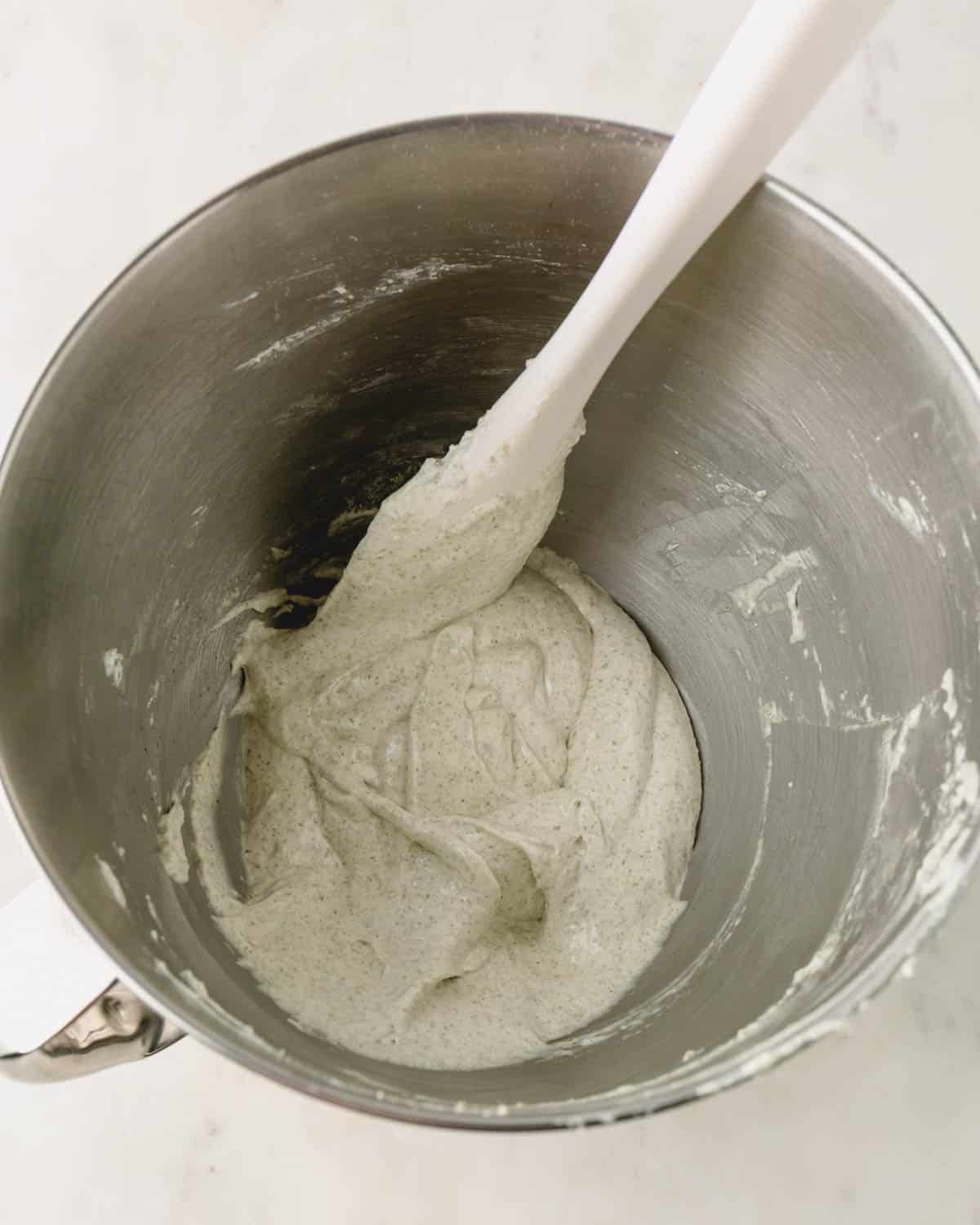Macaron batter at a perfect stage in a mixing bowl.