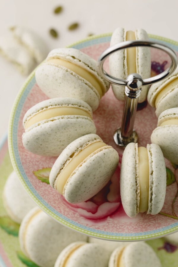 Upclose video of filled nut free macarons arranged on a platter on their sides.