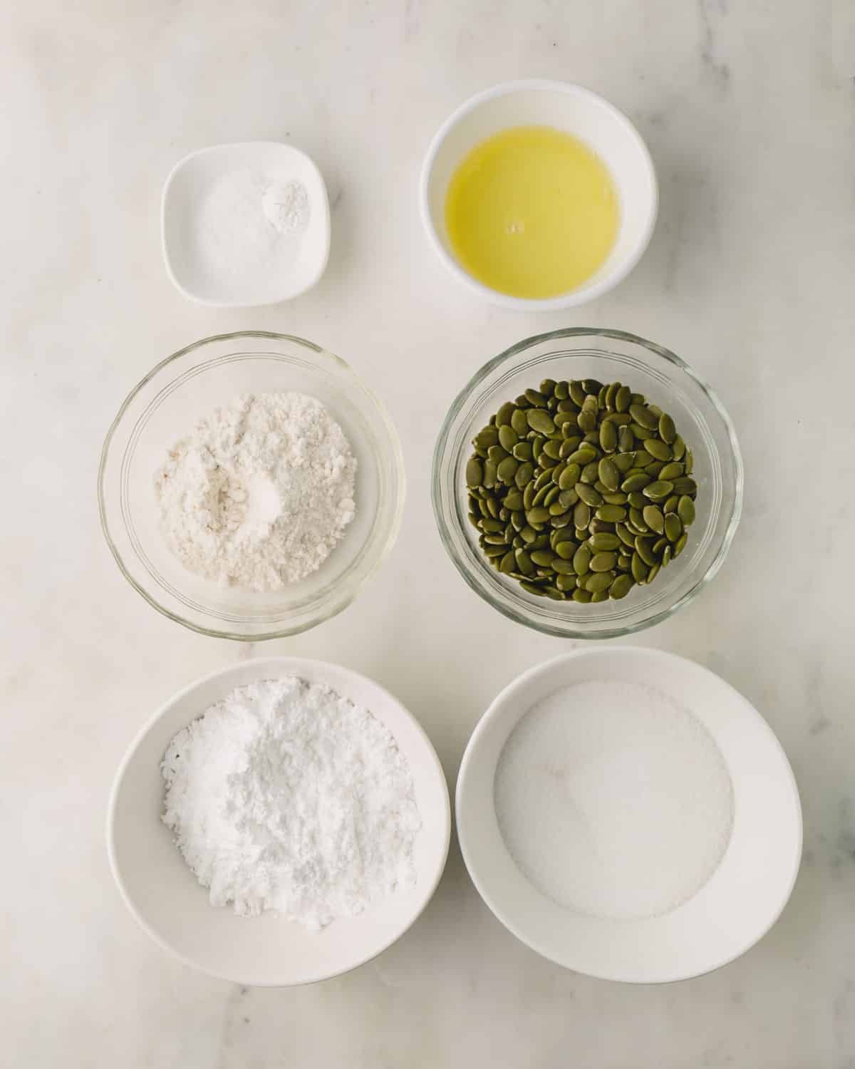 Nut free macaron ingredients in individual bowls.